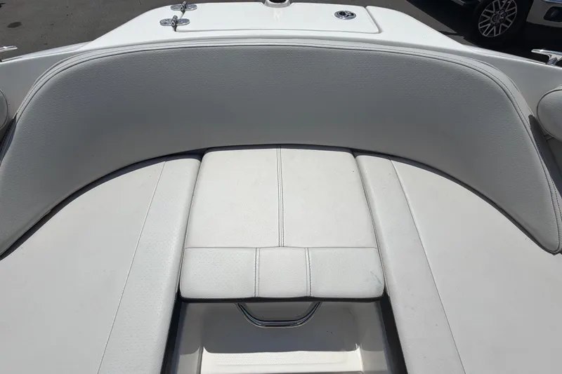 Slide: The Image of 2023 Sea Ray SPX 210 Outboard: Front seating area with white upholstery. - 31