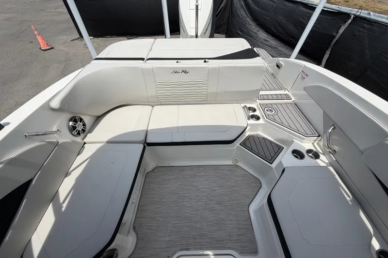 Slide: The Image of 2023 Sea Ray SPX 210 Outboard boat interior with spacious seating and modern design. - 46