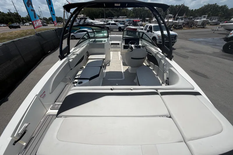 Slide: The Image of 2023 Sea Ray SPX 210 Outboard boat interior with spacious seating and modern design. - 11
