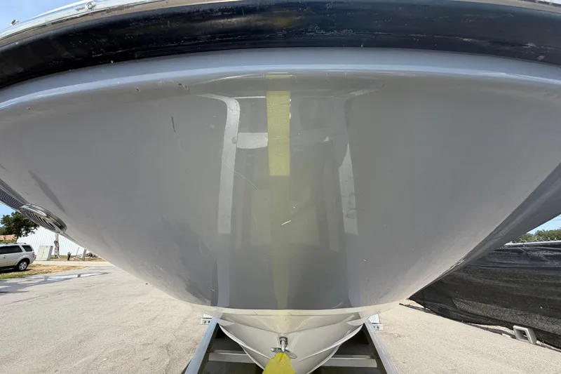 Slide: The Image of 2023 Sea Ray SPX 210 Outboard boat hull on trailer, close-up view. - 9