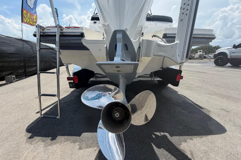 Slide: The Image of 2023 Sea Ray SPX 210 Outboard boat rear view with propeller and ladder. - 4