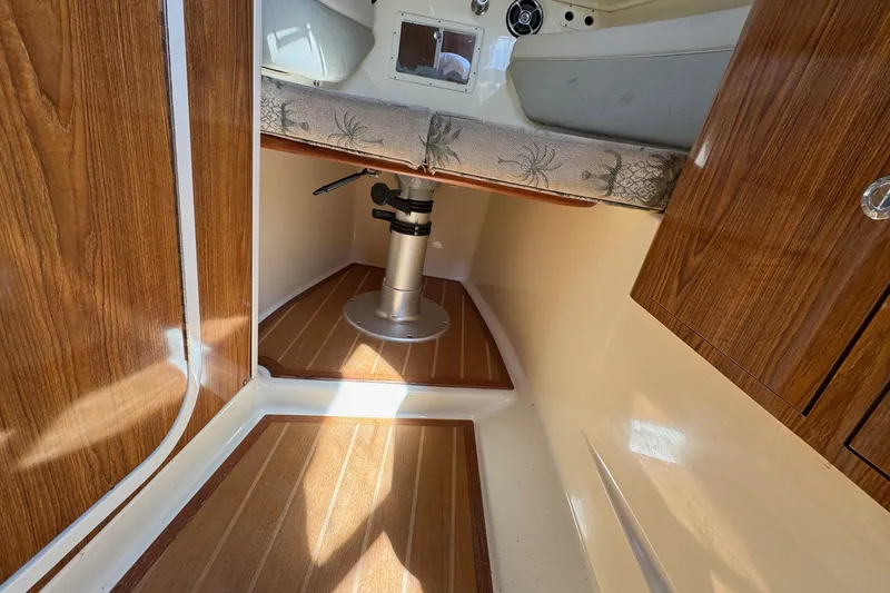 Slide: The Image of Interior cabin of 2008 Scout 295 Abaco boat with wood paneling and seating. - 31