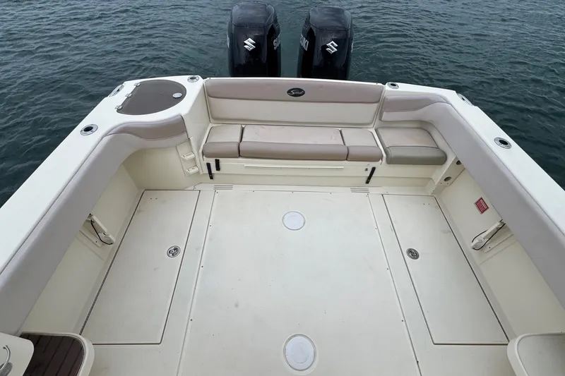 Slide: The Image of 2008 Scout 295 Abaco boat deck with seating and twin Suzuki outboard motors. - 22