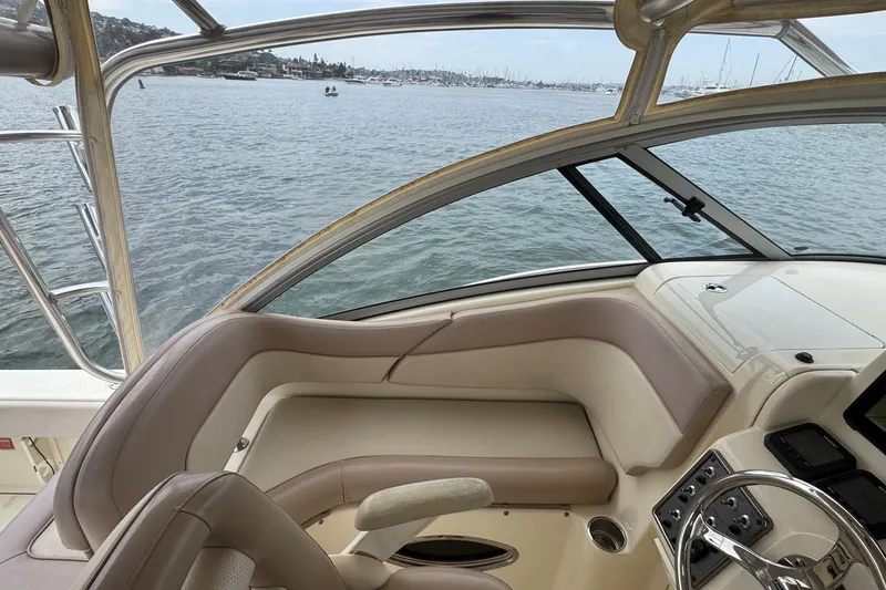 Slide: The Image of Interior view of 2008 Scout 295 Abaco boat with helm and seating area. - 7