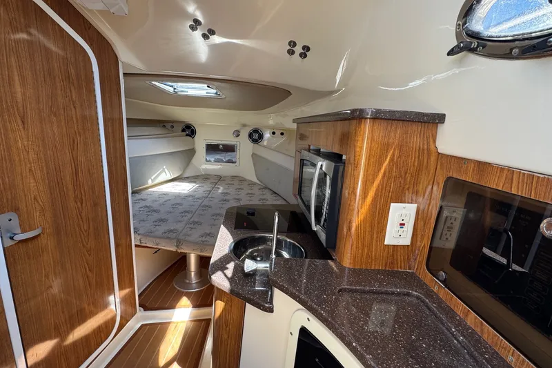 Slide: The Image of Interior of 2008 Scout 295 Abaco boat with kitchenette and sleeping area. - 34