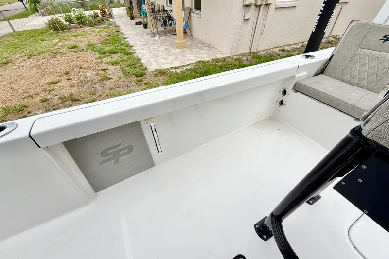 Slide: The Image of 2025 Sea Pro 230 Bay boat interior with seating and storage, showcasing sleek design. - 15