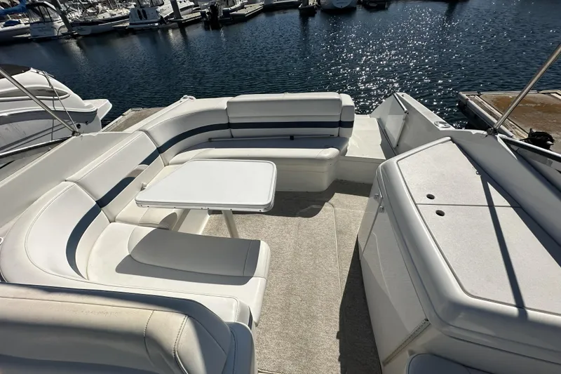 Slide: The Image of Spacious seating area on a 2000 Formula 280 Sun Sport boat docked at a marina. - 8