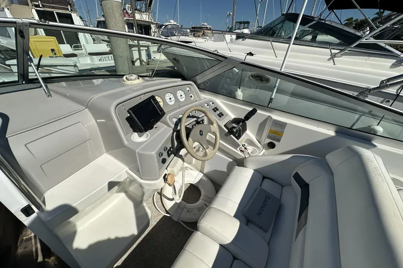 Slide: The Image of Cockpit of a 2000 Formula 280 Sun Sport boat with steering wheel and controls. - 7