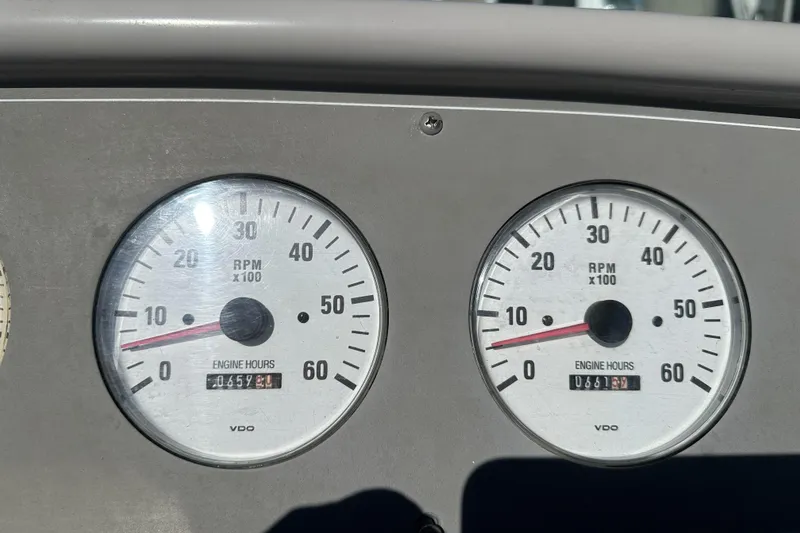 Slide: The Image of Dashboard of a 2000 Formula 280 Sun Sport showing RPM gauges and engine hours. - 16