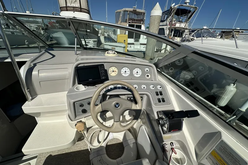 Slide: The Image of Cockpit of 2000 Formula 280 Sun Sport boat with steering wheel and control panel. - 9