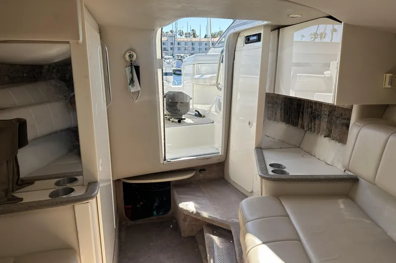 Slide: The Image of Interior of 2000 Formula 280 Sun Sport boat with seating and cabin view. - 13