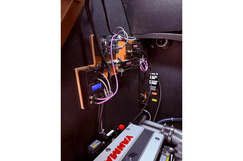 Slide: The Image of Engine room of 2022 Beneteau Oceanis Yacht 54 with Yanmar components and wiring. - 99
