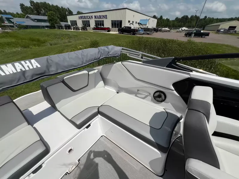 Slide: The Image of The image shows the cockpit of a 2023 Yamaha SX250 boat with gray and white seating. - 20