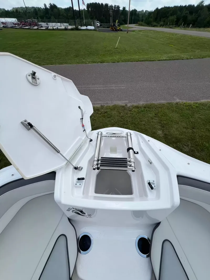 Slide: The Image of The image shows the bow of a Yamaha SX250 boat with an open storage hatch and ladder. - 7