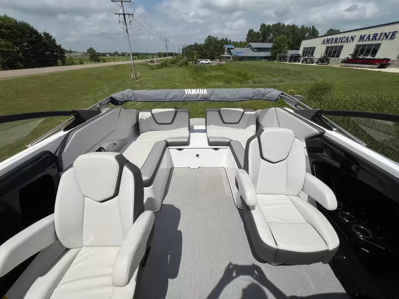 Slide: The Image of The image shows the cockpit of a Yamaha SX250 boat with white seats and gray carpet. - 13