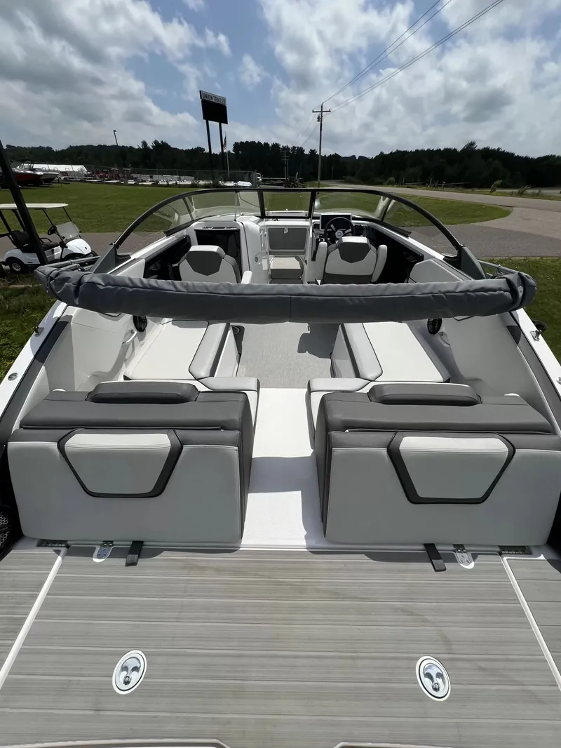 Slide: The Image of The image shows the interior of a 2023 Yamaha SX250 boat with gray and white seating. - 21