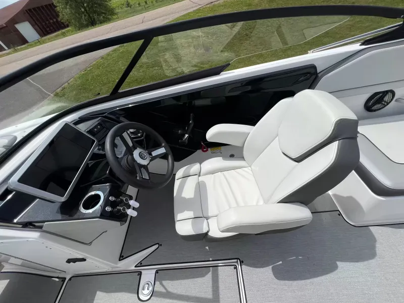 Slide: The Image of The image shows the cockpit of a Yamaha SX250 boat with a modern helm and comfortable seat. - 17