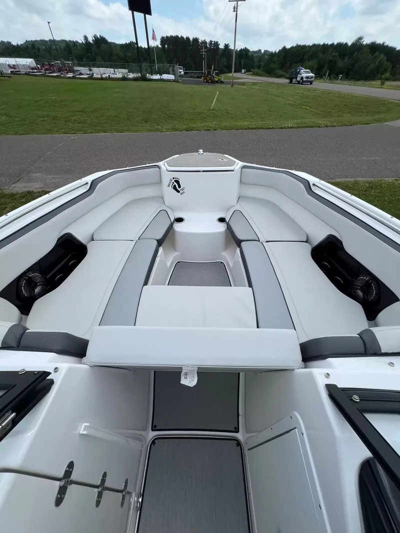 Slide: The Image of The image shows the cockpit of a 2023 Yamaha SX250 boat with gray and white seating. - 10