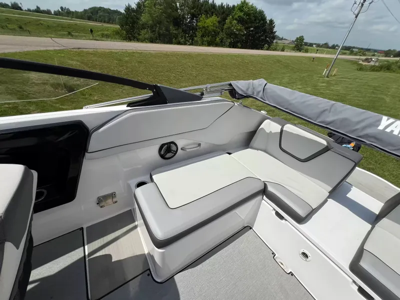 Slide: The Image of The image shows the cockpit of a Yamaha SX250 boat with gray and white seating. - 19