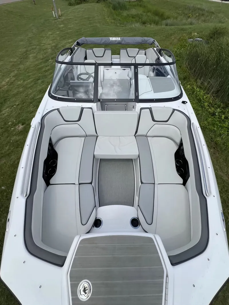 Slide: The Image of 2023 Yamaha SX250 with a stylish, spacious interior and gray upholstery, parked on grass. - 6