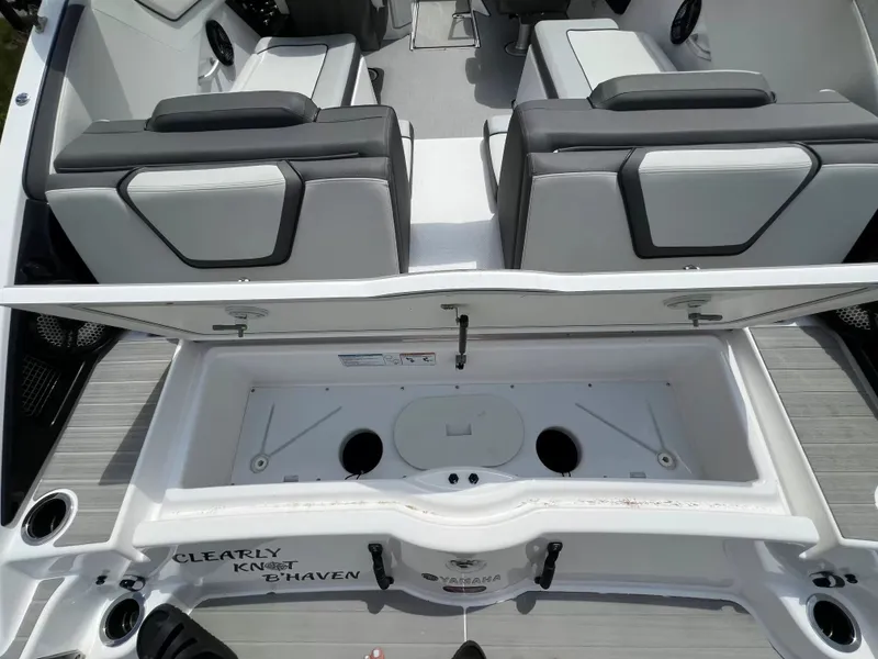 Slide: The Image of Interior view of a Yamaha SX250 boat with gray and white seating. - 24