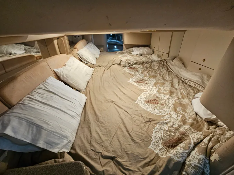 Slide: The Image of The image shows a cozy cabin with a large bed and several pillows. - 15