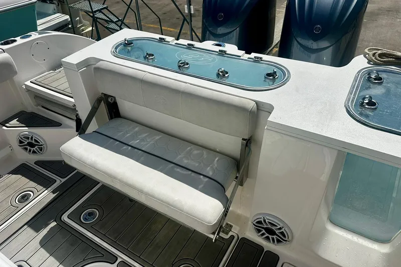 Slide: The Image of Sea Fox 228 Commander 2002 boat interior with seating and storage compartments. - 10