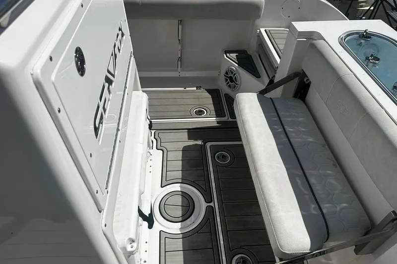Slide: The Image of Sea Fox 228 Commander 2002 boat interior with seating and deck details. - 14