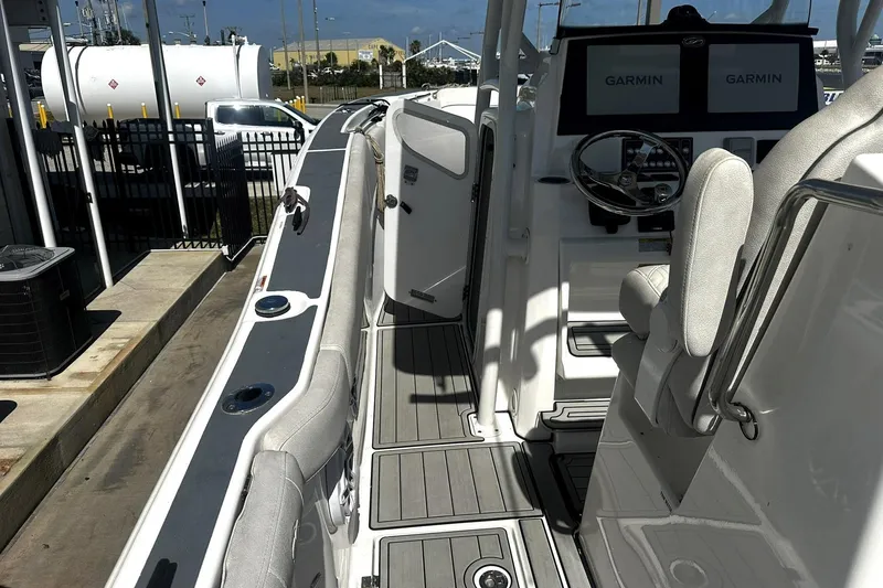 Slide: The Image of Interior view of a 2002 Sea Fox 228 Commander boat with Garmin navigation displays. - 16