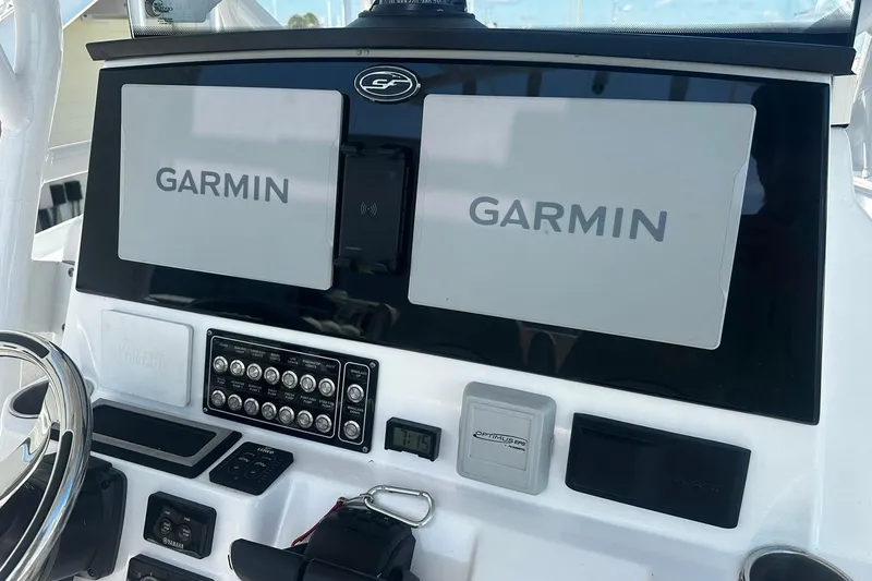 Slide: The Image of Dashboard of a 2002 Sea Fox 228 Commander with Garmin navigation displays. - 19