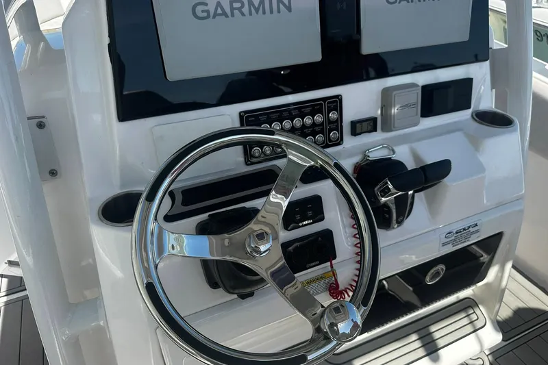 Slide: The Image of Steering console of a 2002 Sea Fox 228 Commander boat with Garmin displays. - 21