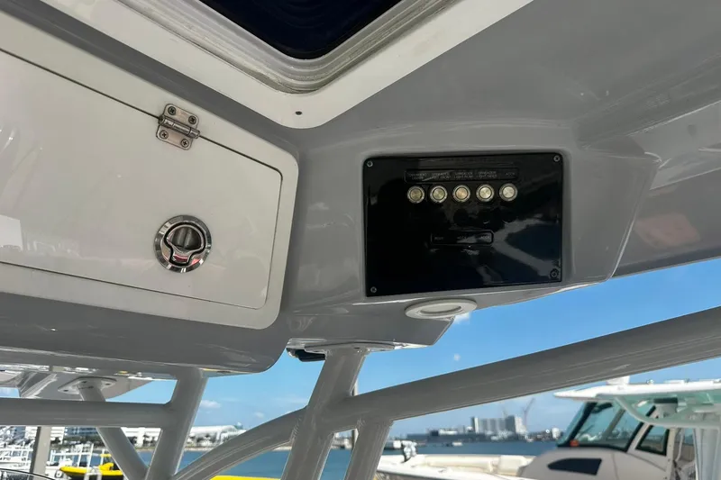 Slide: The Image of 2002 Sea Fox 228 Commander boat console with control panel and storage compartment. - 22