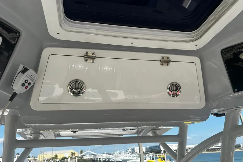 Slide: The Image of Storage compartment on a 2002 Sea Fox 228 Commander boat, with ocean view background. - 23