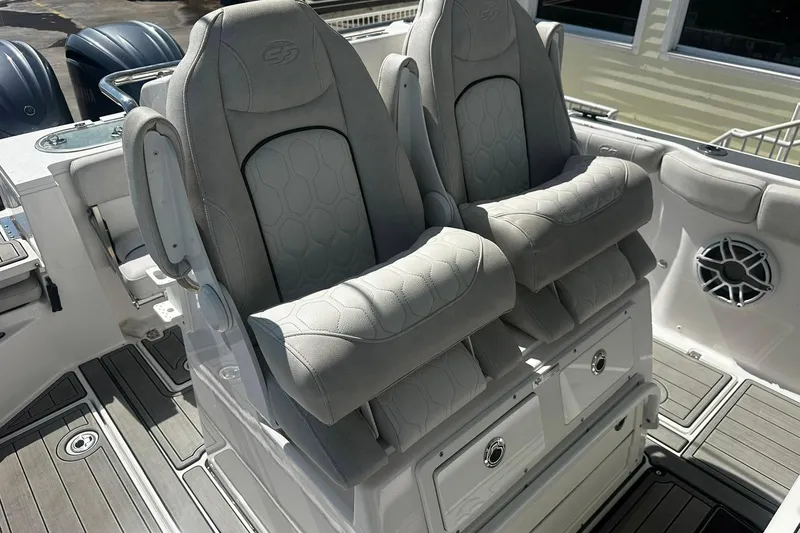 Slide: The Image of Luxury seating on a 2002 Sea Fox 228 Commander boat, featuring plush gray upholstery. - 27