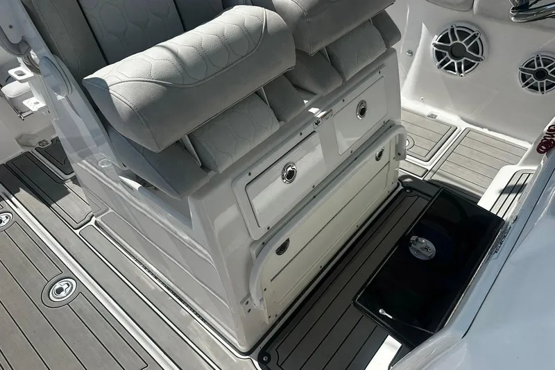 Slide: The Image of Interior of 2002 Sea Fox 228 Commander boat with cushioned seating and storage compartments. - 28