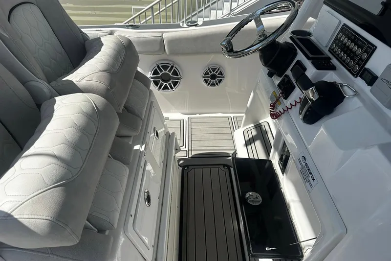 Slide: The Image of Interior view of 2002 Sea Fox 228 Commander boat with steering wheel and seating. - 29