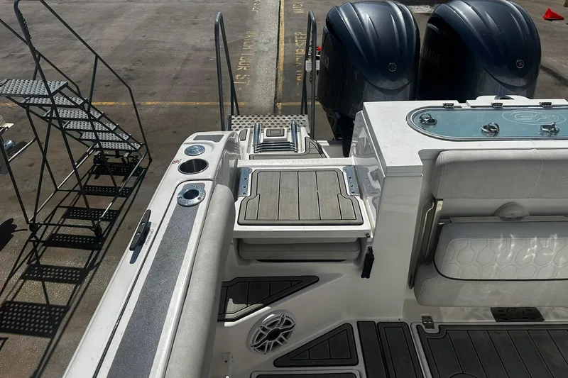 Slide: The Image of Sea Fox 228 Commander boat interior with dual engines and seating, 2002 model. - 3