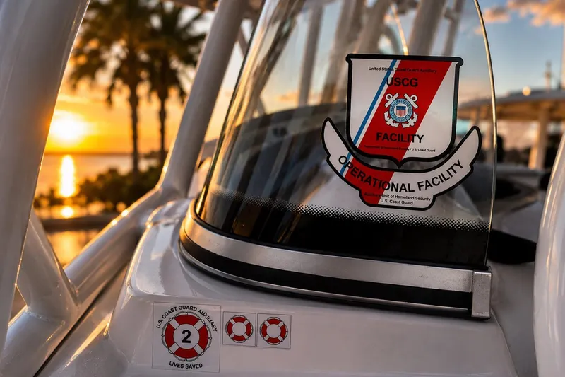 Slide: The Image of Boat with USCG Operational Facility sticker at sunset, Sea Fox 228 Commander, 2002 model. - 31
