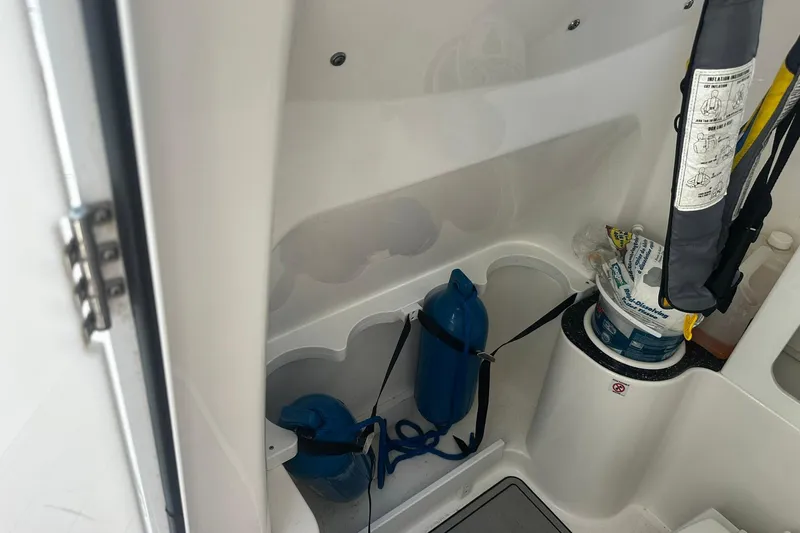 Slide: The Image of Interior storage of 2002 Sea Fox 228 Commander boat with safety equipment. - 33
