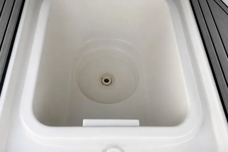 Slide: The Image of Storage compartment of a 2002 Sea Fox 228 Commander boat, featuring a clean, white interior. - 40
