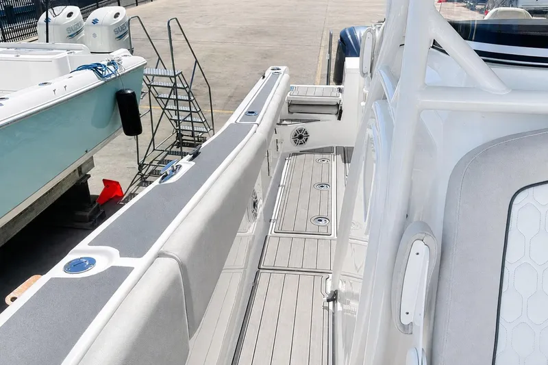 Slide: The Image of Sea Fox 228 Commander 2002 boat interior with sleek seating and deck details. - 41