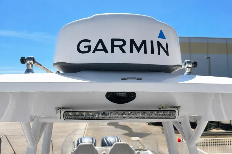 Slide: The Image of Garmin radar on 2002 Sea Fox 228 Commander boat under clear blue sky. - 43
