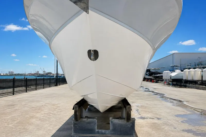 Slide: The Image of Sea Fox 228 Commander boat on dry dock, showcasing hull design, 2002 model. - 48