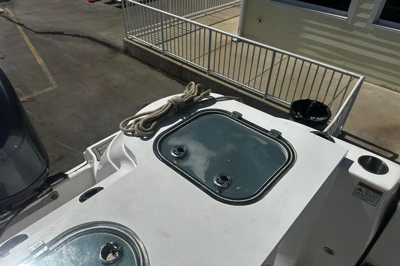 Slide: The Image of Sea Fox 228 Commander boat deck with rope and hatch, 2002 model. - 6