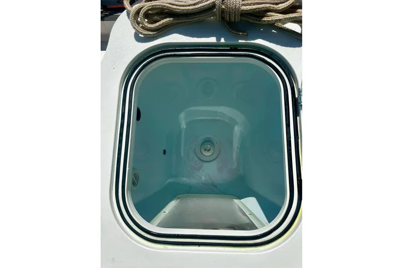 Slide: The Image of Open hatch on 2002 Sea Fox 228 Commander boat, showcasing interior compartment. - 7