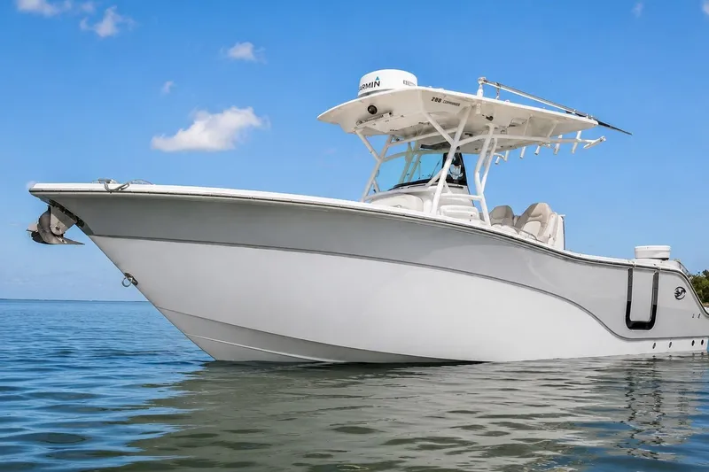 The Image of 2022 Sea Fox 288 Commander boat on calm water under clear blue sky. - 0