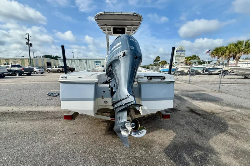 Slide: The Image of 2023 Robalo 206 Cayman boat with Yamaha outboard motor, parked outdoors. - 5
