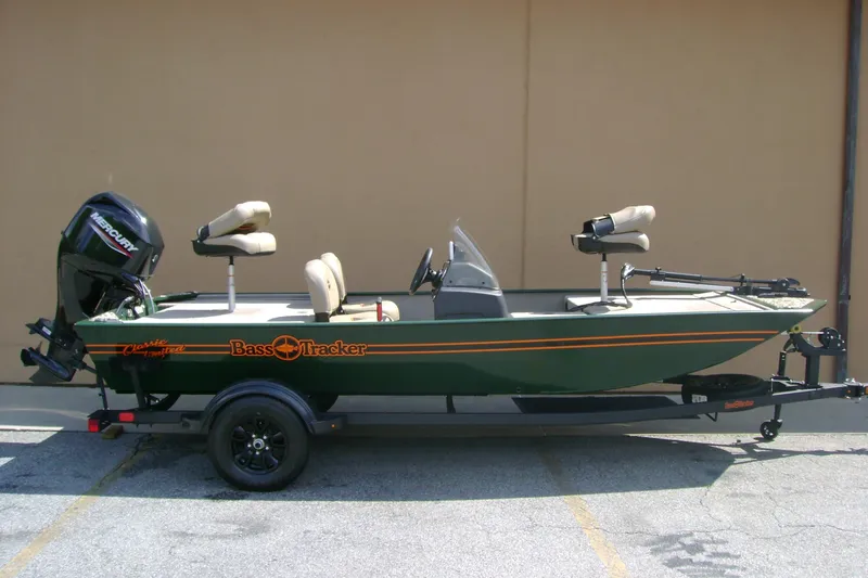 The Image of 2026 Tracker Bass Tracker Classic Limited fishing boat with Mercury engine, parked on trailer. - 0