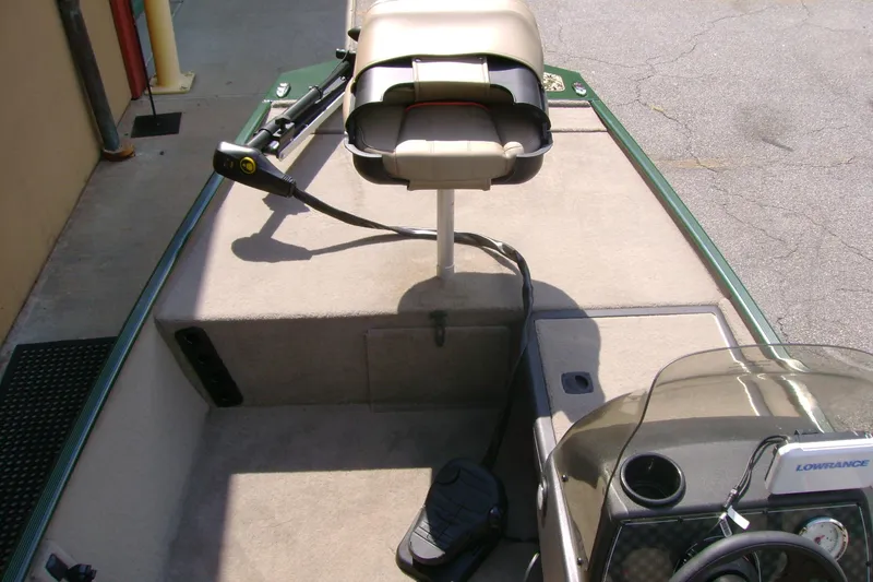 Slide: The Image of 2026 Tracker Bass Tracker Classic Limited boat interior with seat and control panel. - 5
