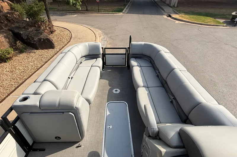 Slide: The Image of 2024 Regency 250 DL3 pontoon boat with spacious seating and modern design. - 21